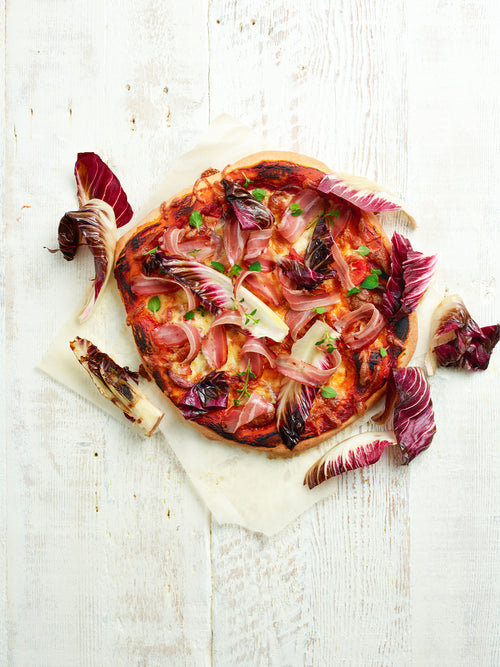 Pizza With Wild Boar Salami, Pancetta, Goat Cheese And Grilled Treviso